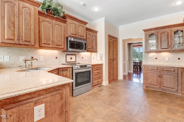 106 Woodmere Ln, Goldsboro, NC 27530 - kitchen featuring stainless steel appliances, light stone counters, glass insert cabinets, tasteful backsplash, and ornamental molding