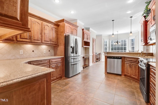 106 Woodmere Ln, Goldsboro, NC 27530 - kitchen with stainless steel appliances, ornamental molding, light stone countertops, tasteful backsplash, and hanging light fixtures