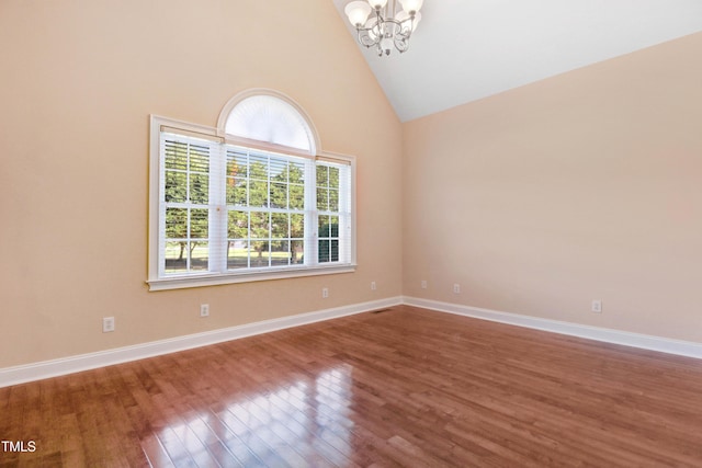 106 Woodmere Ln, Goldsboro, NC 27530 - unfurnished room with a chandelier, wood finished floors, and high vaulted ceiling
