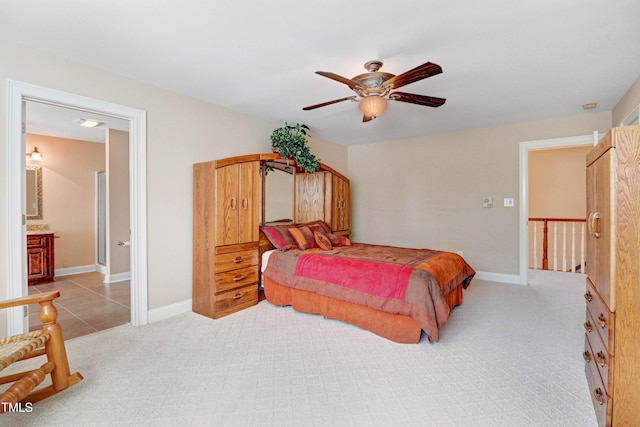 106 Woodmere Ln, Goldsboro, NC 27530 - bedroom with light carpet, a ceiling fan, and connected bathroom