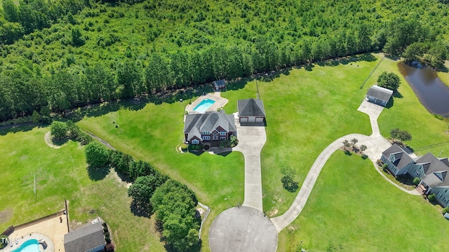 106 Woodmere Ln, Goldsboro, NC 27530 - drone / aerial view of a pool area and a heavily wooded area