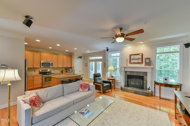 119 Jones Creek Pl Unit 119, Chapel Hill, NC 27516 - living area with light wood-type flooring, ceiling fan, recessed lighting, a fireplace, and crown molding