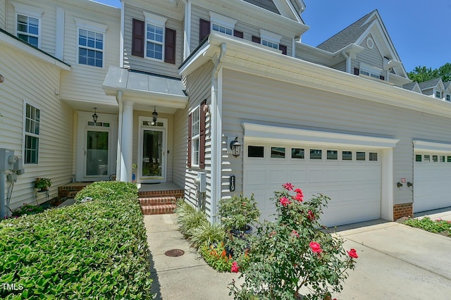 119 Jones Creek Pl Unit 119, Chapel Hill, NC 27516 - property entrance featuring concrete driveway, a standing seam roof, and a metal roof