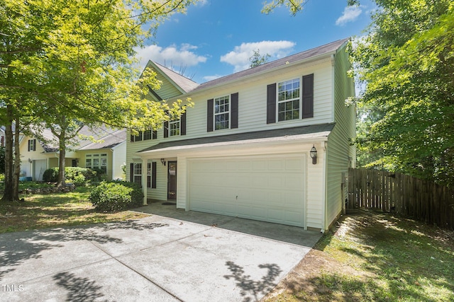 709 Woodgreen Dr, Durham, NC 27704 - traditional-style home featuring an attached garage and driveway