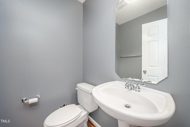709 Woodgreen Dr, Durham, NC 27704 - bathroom featuring a sink and toilet