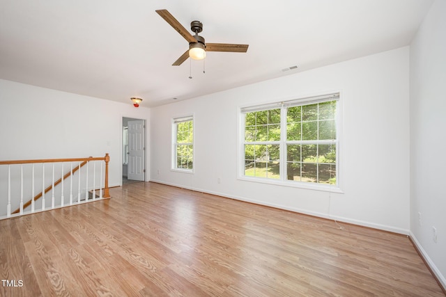 709 Woodgreen Dr, Durham, NC 27704 - spare room with light wood-style flooring and a ceiling fan
