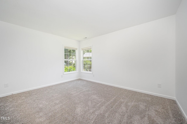 709 Woodgreen Dr, Durham, NC 27704 - carpeted empty room with baseboards