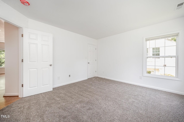 709 Woodgreen Dr, Durham, NC 27704 - carpeted empty room featuring baseboards