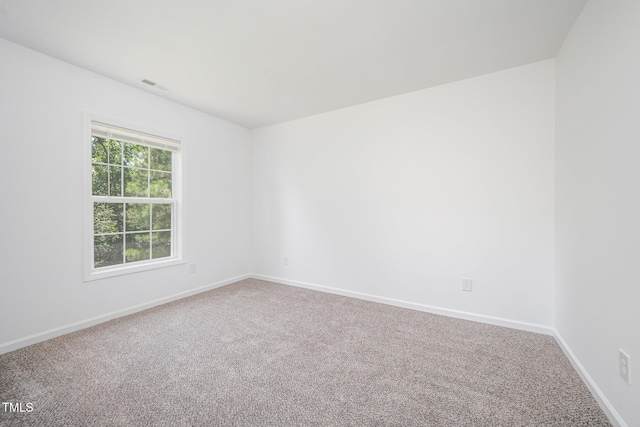 709 Woodgreen Dr, Durham, NC 27704 - carpeted spare room with baseboards