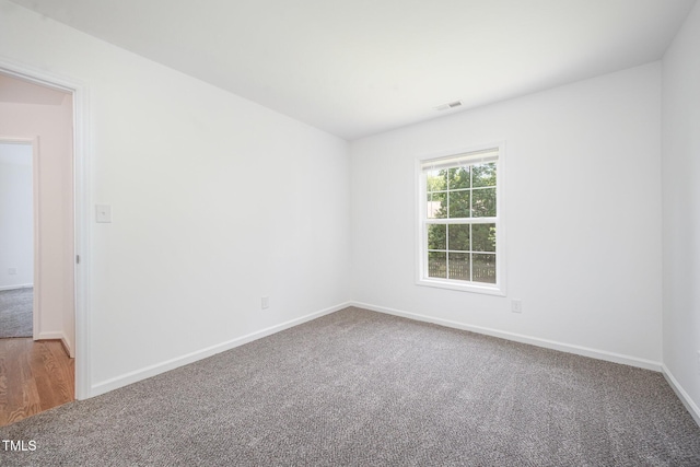 709 Woodgreen Dr, Durham, NC 27704 - carpeted spare room with baseboards