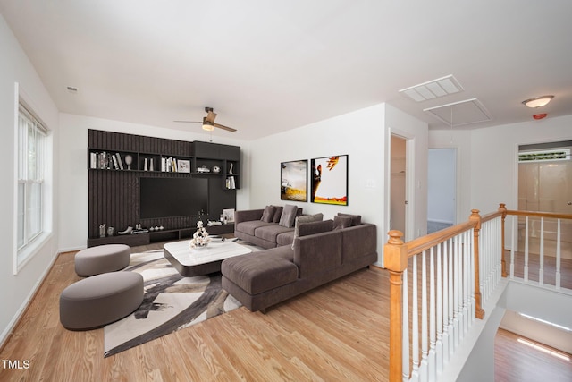 709 Woodgreen Dr, Durham, NC 27704 - living area with attic access, wood finished floors, ceiling fan, and healthy amount of natural light