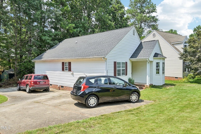 2636 Scattered Oak Ct, Raleigh, NC 27603 - view of front of house with crawl space, a shingled roof, a front yard, and concrete driveway
