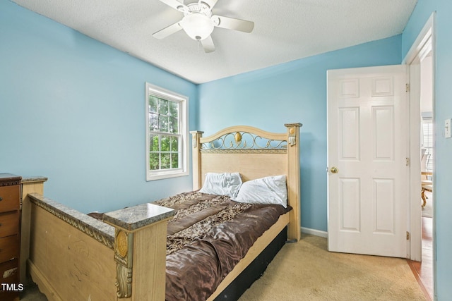 2636 Scattered Oak Ct, Raleigh, NC 27603 - bedroom featuring carpet floors, a textured ceiling, and ceiling fan