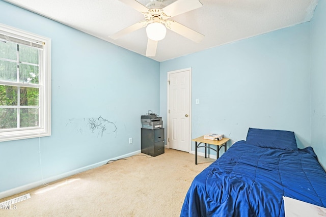 2636 Scattered Oak Ct, Raleigh, NC 27603 - bedroom featuring light colored carpet, multiple windows, and ceiling fan