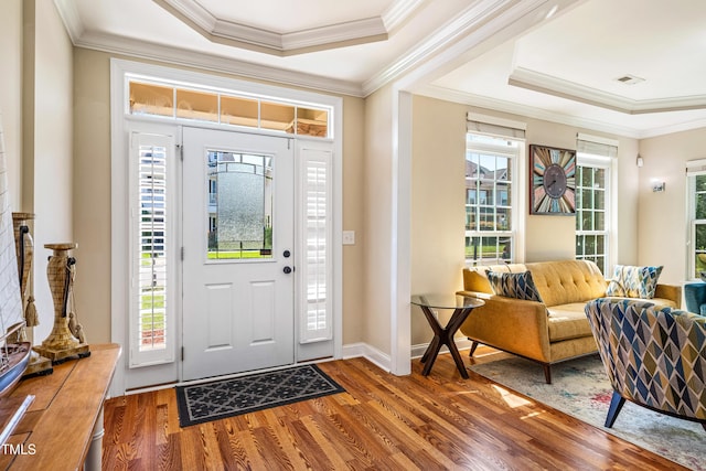 2129 Glade Valley Ln, Morrisville, NC 27560 - entrance foyer with wood finished floors, crown molding, and a tray ceiling