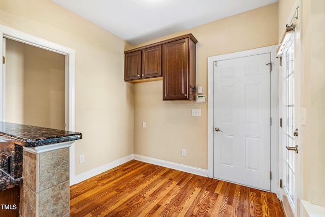 2129 Glade Valley Ln, Morrisville, NC 27560 - laundry area featuring wood finished floors and baseboards
