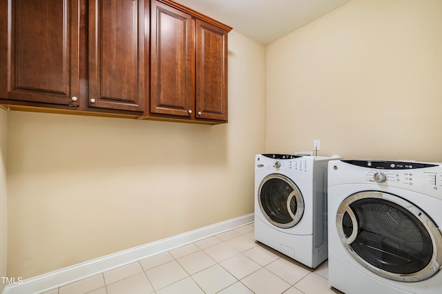 2129 Glade Valley Ln, Morrisville, NC 27560 - laundry room featuring separate washer and dryer, cabinet space, and light tile patterned flooring