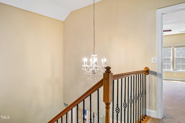 2129 Glade Valley Ln, Morrisville, NC 27560 - staircase featuring a chandelier, carpet flooring, and vaulted ceiling