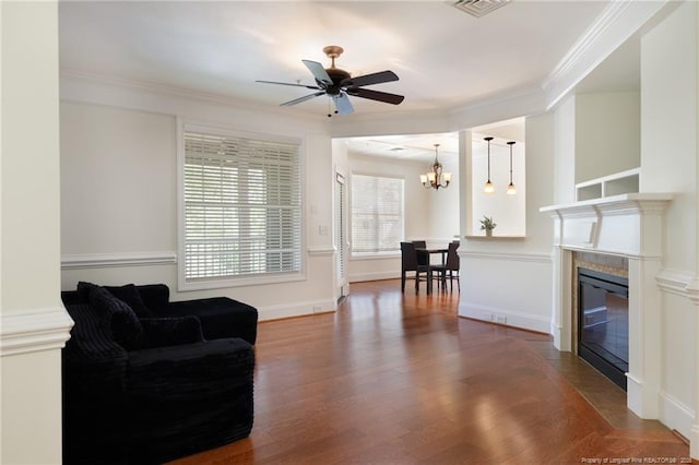 3310 Starboard Way Unit 301, Fayetteville, NC 28314 - living room featuring a ceiling fan, wood finished floors, a chandelier, ornamental molding, and a glass covered fireplace