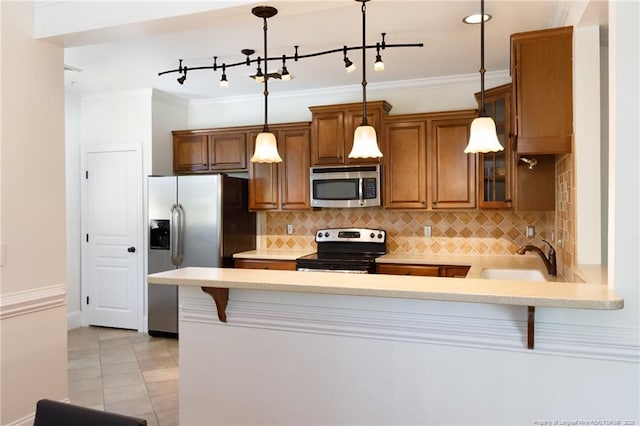 3310 Starboard Way Unit 301, Fayetteville, NC 28314 - kitchen with stainless steel appliances, brown cabinets, light countertops, decorative backsplash, and crown molding