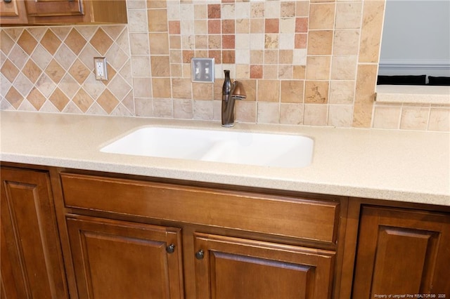 3310 Starboard Way Unit 301, Fayetteville, NC 28314 - detailed view of brown cabinets, backsplash, and light countertops