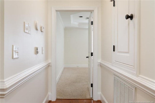 3310 Starboard Way Unit 301, Fayetteville, NC 28314 - corridor featuring ornamental molding, carpet floors, and a raised ceiling