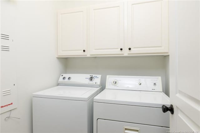 3310 Starboard Way Unit 301, Fayetteville, NC 28314 - washroom featuring separate washer and dryer and cabinet space
