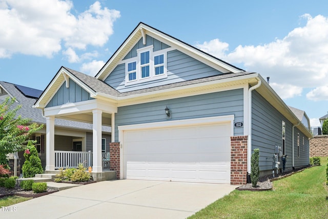 833 Atticus Way, Durham, NC 27703 - craftsman-style house featuring covered porch, brick siding, concrete driveway, roof with shingles, and board and batten siding