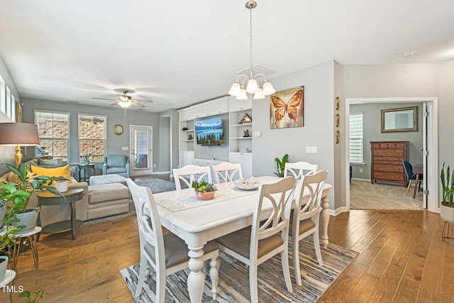 833 Atticus Way, Durham, NC 27703 - dining space featuring hardwood / wood-style flooring, a ceiling fan, a chandelier, and built in features