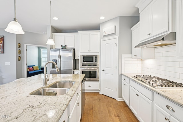 833 Atticus Way, Durham, NC 27703 - kitchen featuring stainless steel appliances, under cabinet range hood, white cabinets, recessed lighting, and tasteful backsplash
