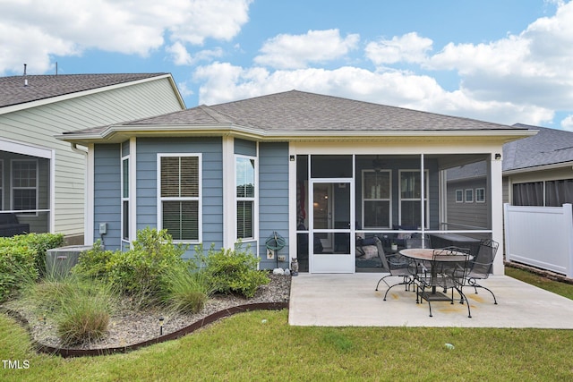 833 Atticus Way, Durham, NC 27703 - rear view of property featuring a patio, a sunroom, and a shingled roof