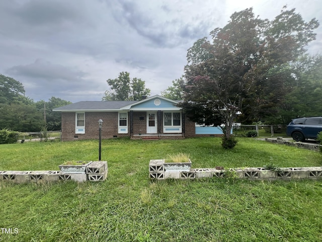 503 Adams St, Henderson, NC 27536 - view of front of property with brick siding and a front yard