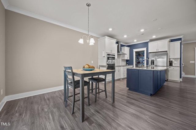 22 Combine Trl, Benson, NC 27504 - kitchen featuring crown molding, stainless steel fridge with ice dispenser, wall chimney range hood, dark wood-type flooring, and white cabinets