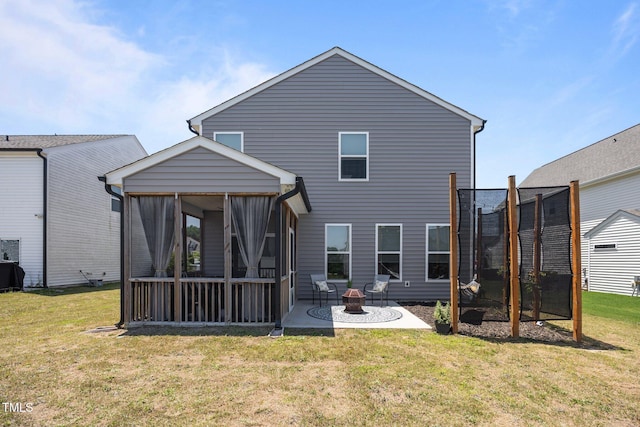 22 Combine Trl, Benson, NC 27504 - back of house featuring a sunroom, a lawn, a patio area, and an outdoor fire pit