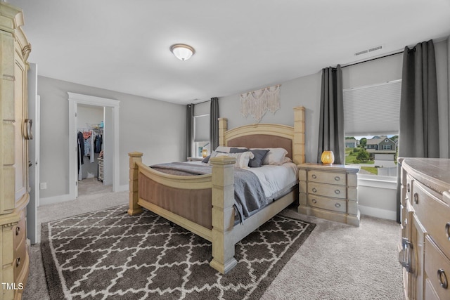 22 Combine Trl, Benson, NC 27504 - carpeted bedroom with a walk in closet and baseboards