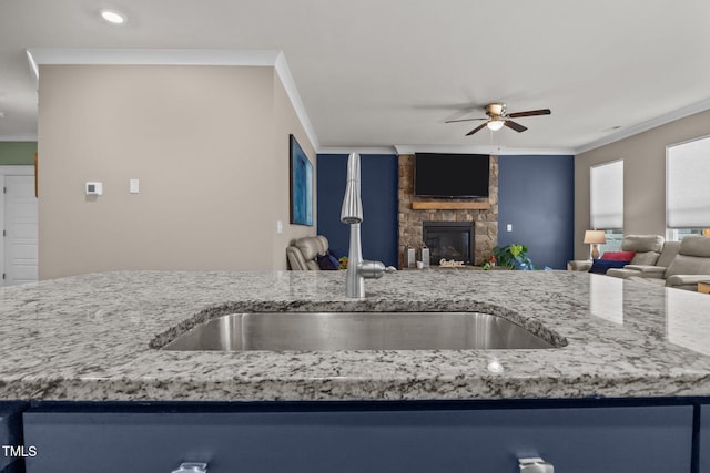 22 Combine Trl, Benson, NC 27504 - kitchen with ceiling fan, open floor plan, ornamental molding, light stone countertops, and a fireplace