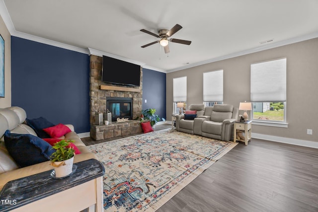22 Combine Trl, Benson, NC 27504 - living room with a ceiling fan, wood finished floors, ornamental molding, and a stone fireplace