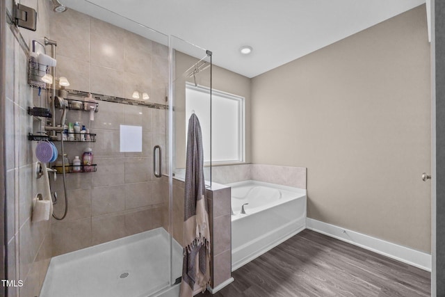 22 Combine Trl, Benson, NC 27504 - full bathroom featuring a stall shower, a garden tub, and wood finished floors