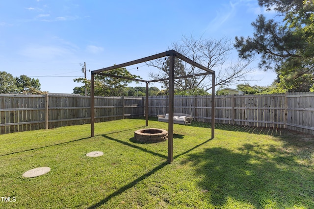10 Wilders Ln, Louisburg, NC 27549 - fenced backyard featuring an outdoor fire pit