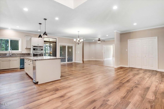 206 Tramway Pl, Goldsboro, NC 27534 - kitchen featuring ornamental molding, a center island, a chandelier, recessed lighting, and white cabinets