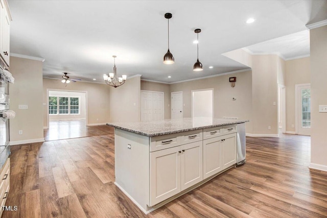 206 Tramway Pl, Goldsboro, NC 27534 - kitchen with light wood-style flooring, a ceiling fan, a center island, open floor plan, and recessed lighting