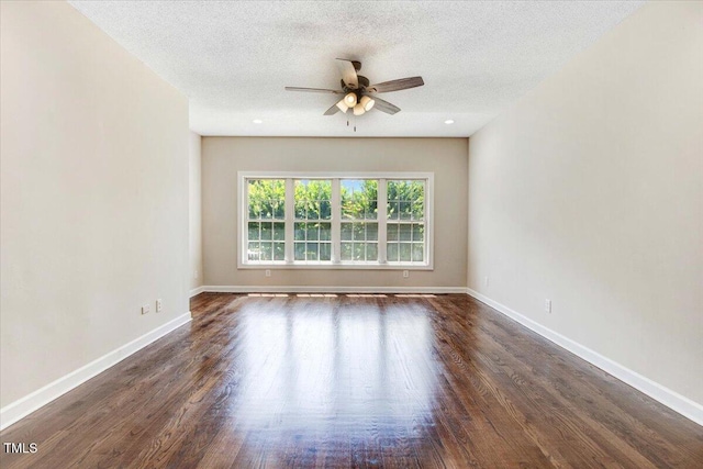206 Tramway Pl, Goldsboro, NC 27534 - spare room with a ceiling fan, a textured ceiling, and dark wood-style floors