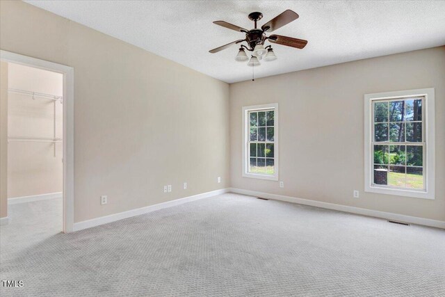 206 Tramway Pl, Goldsboro, NC 27534 - empty room featuring carpet, ceiling fan, and a textured ceiling
