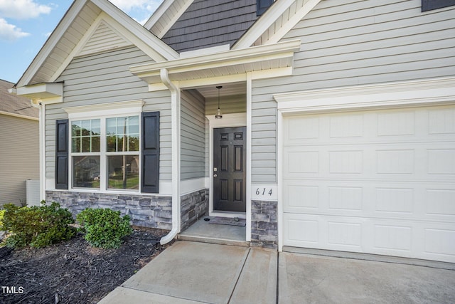 614 Marian Way, Sanford, NC 27330 - doorway to property with a garage and stone siding