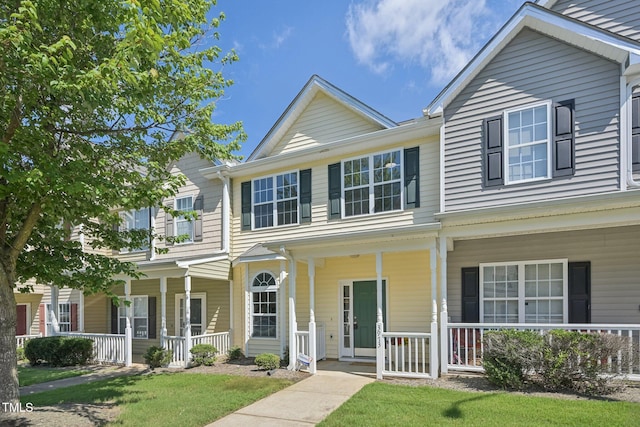 3973 Volkswalk Pl, Raleigh, NC 27610 - townhome / multi-family property featuring covered porch