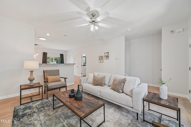 3973 Volkswalk Pl, Raleigh, NC 27610 - living room with light wood finished floors, ceiling fan, and recessed lighting