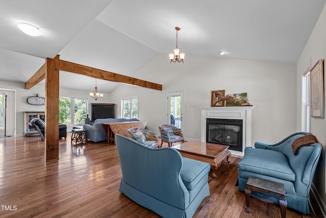 3511 Corbett Rd, Mebane, NC 27302 - living area with a fireplace, a chandelier, lofted ceiling, and hardwood / wood-style flooring