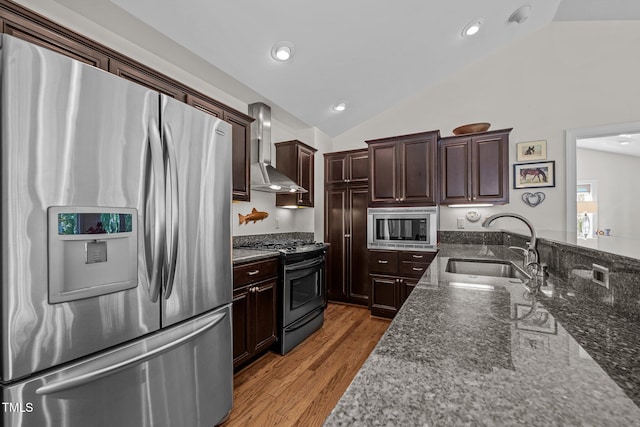 3511 Corbett Rd, Mebane, NC 27302 - kitchen with appliances with stainless steel finishes, wall chimney exhaust hood, lofted ceiling, dark stone counters, and light wood-style floors