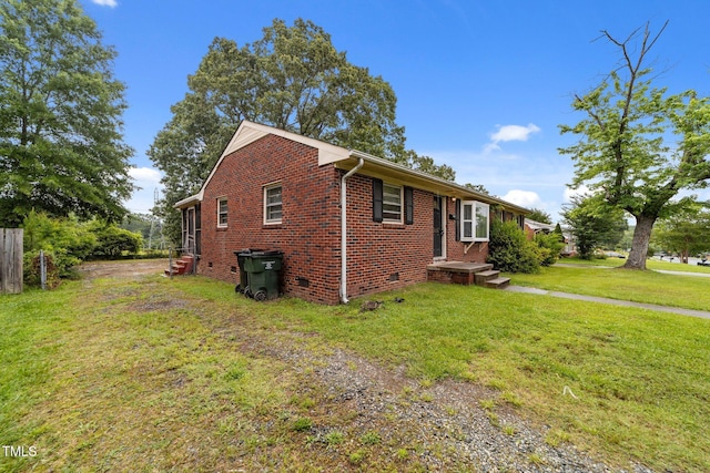 2512 Mckinney St, Burlington, NC 27217 - view of side of home featuring brick siding, crawl space, a yard, and driveway