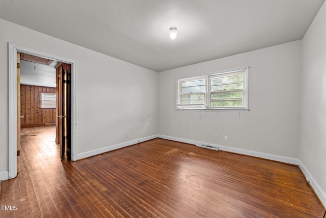 2512 Mckinney St, Burlington, NC 27217 - spare room with healthy amount of natural light, wood finished floors, and attic access